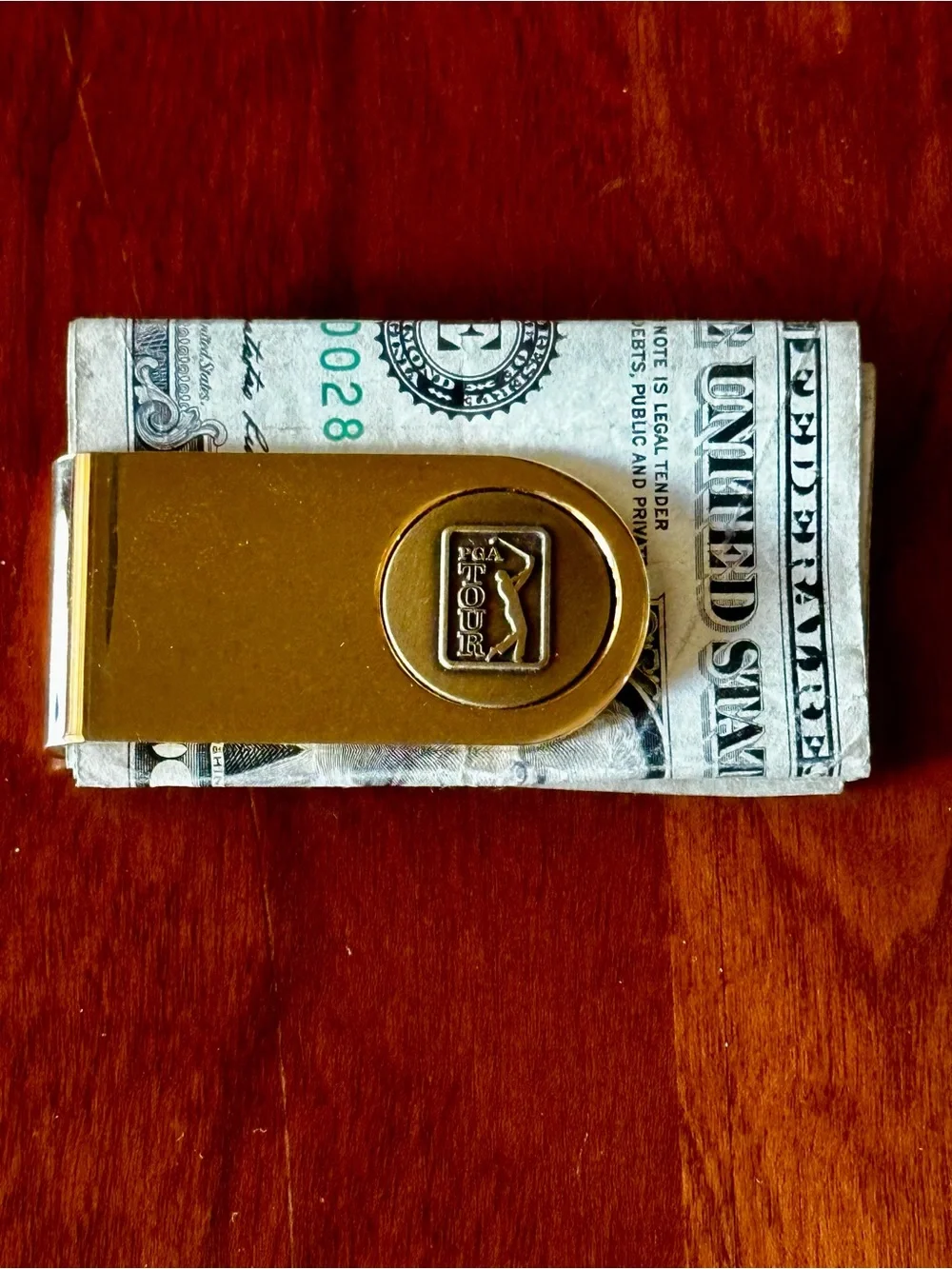 PGA Tour Money Clip Goldtone with PGA Tour Ball Marker embedded on front.